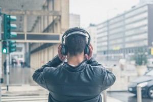 Back view of a young man with headphones